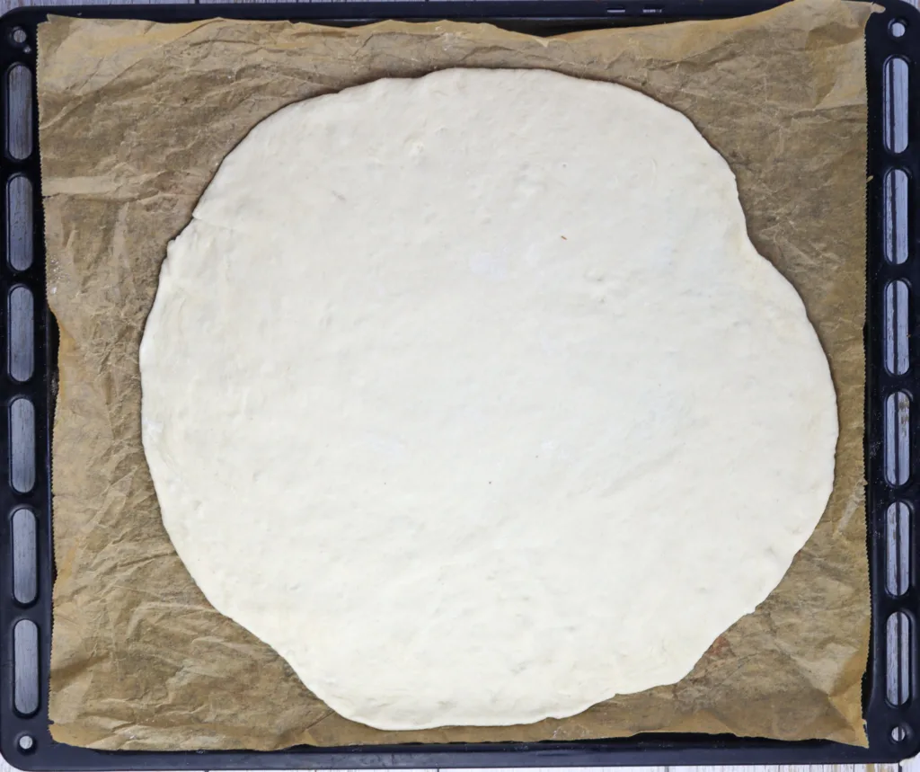 step 8: stretching the dough for pizza with porcini